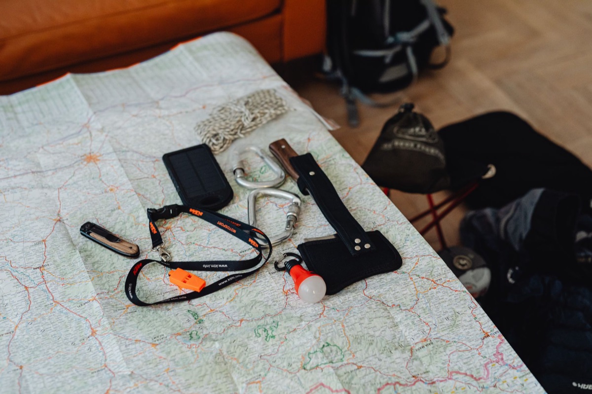 Icelandic camping gear rental station with a map and a backpack