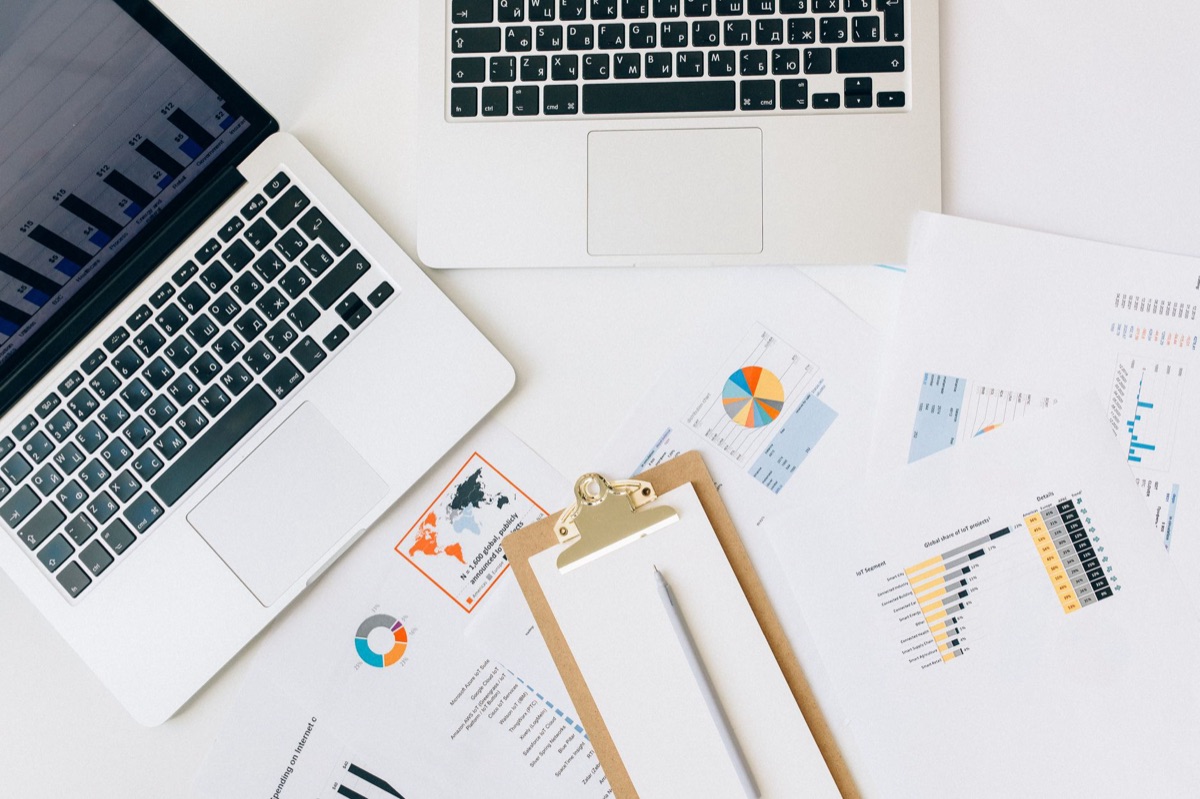 clean office interior with laptop and financial data